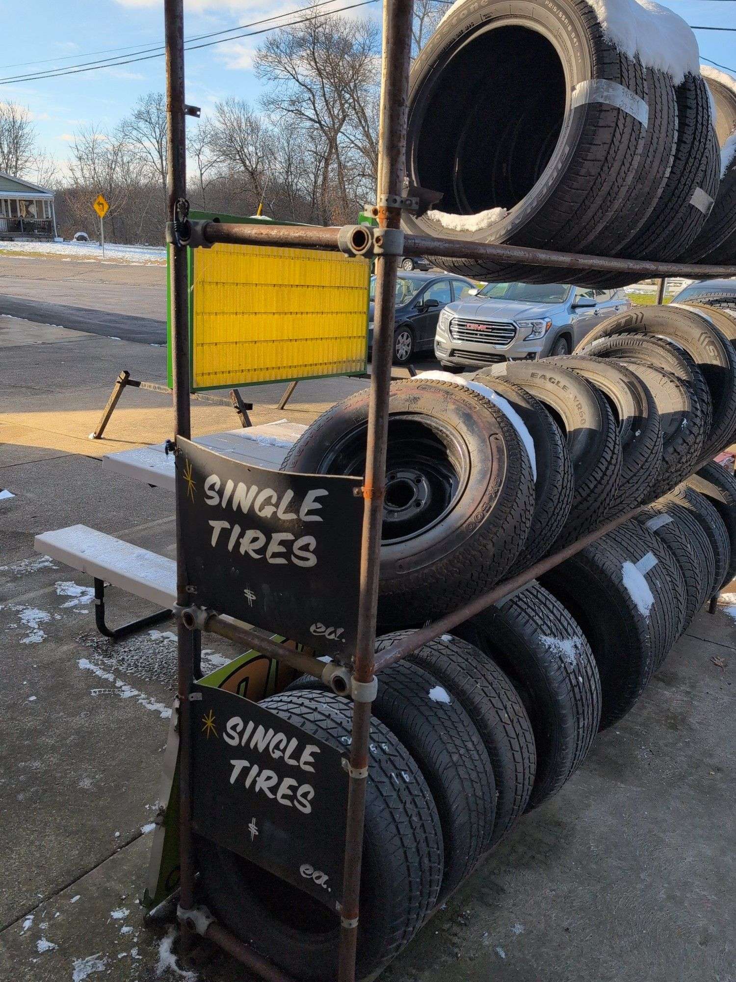 Metal tire rack - 21' x 18" x 7' - stored outside, contents not included