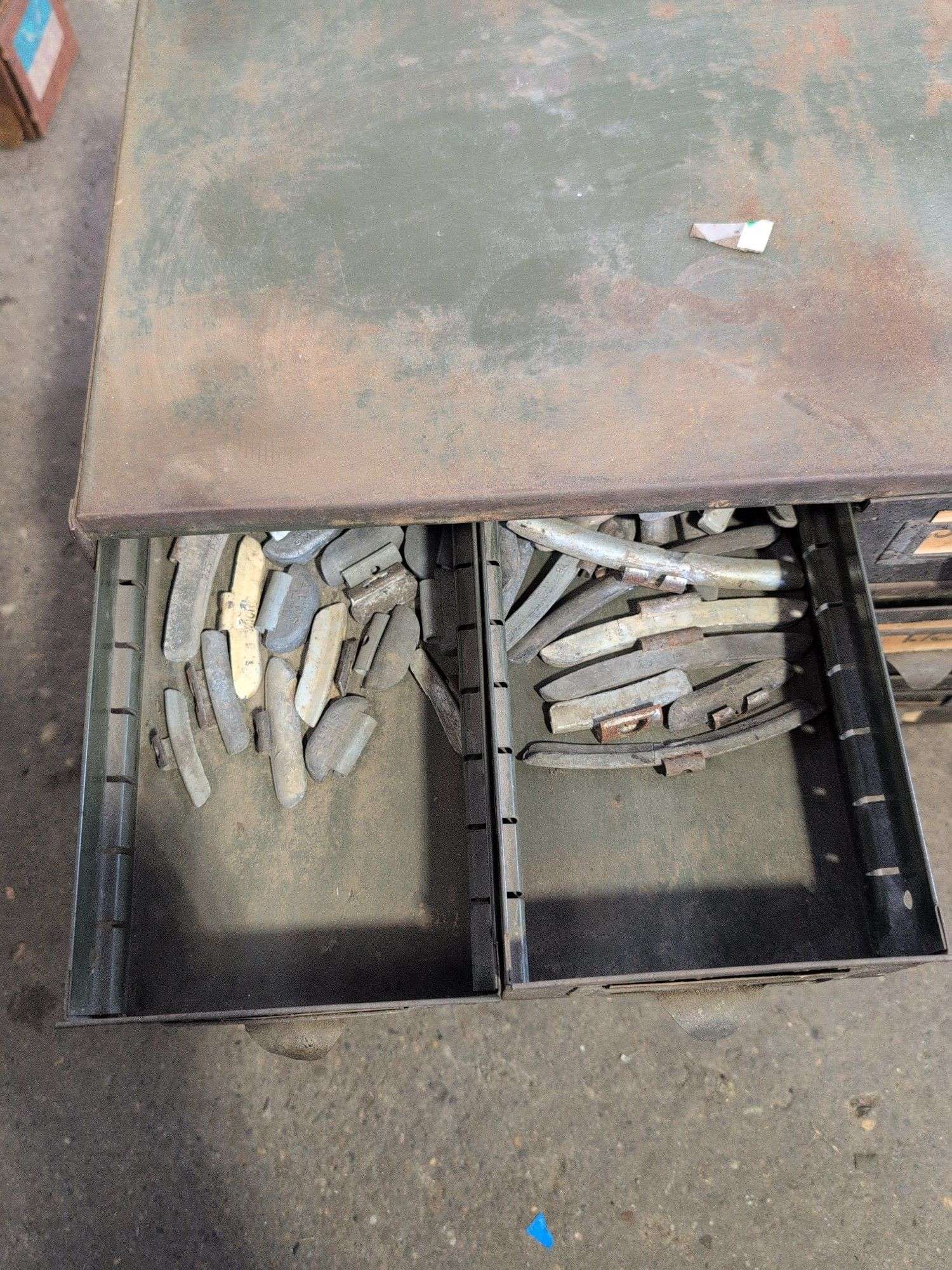 Metal hardware cabinet with nuts and bolts