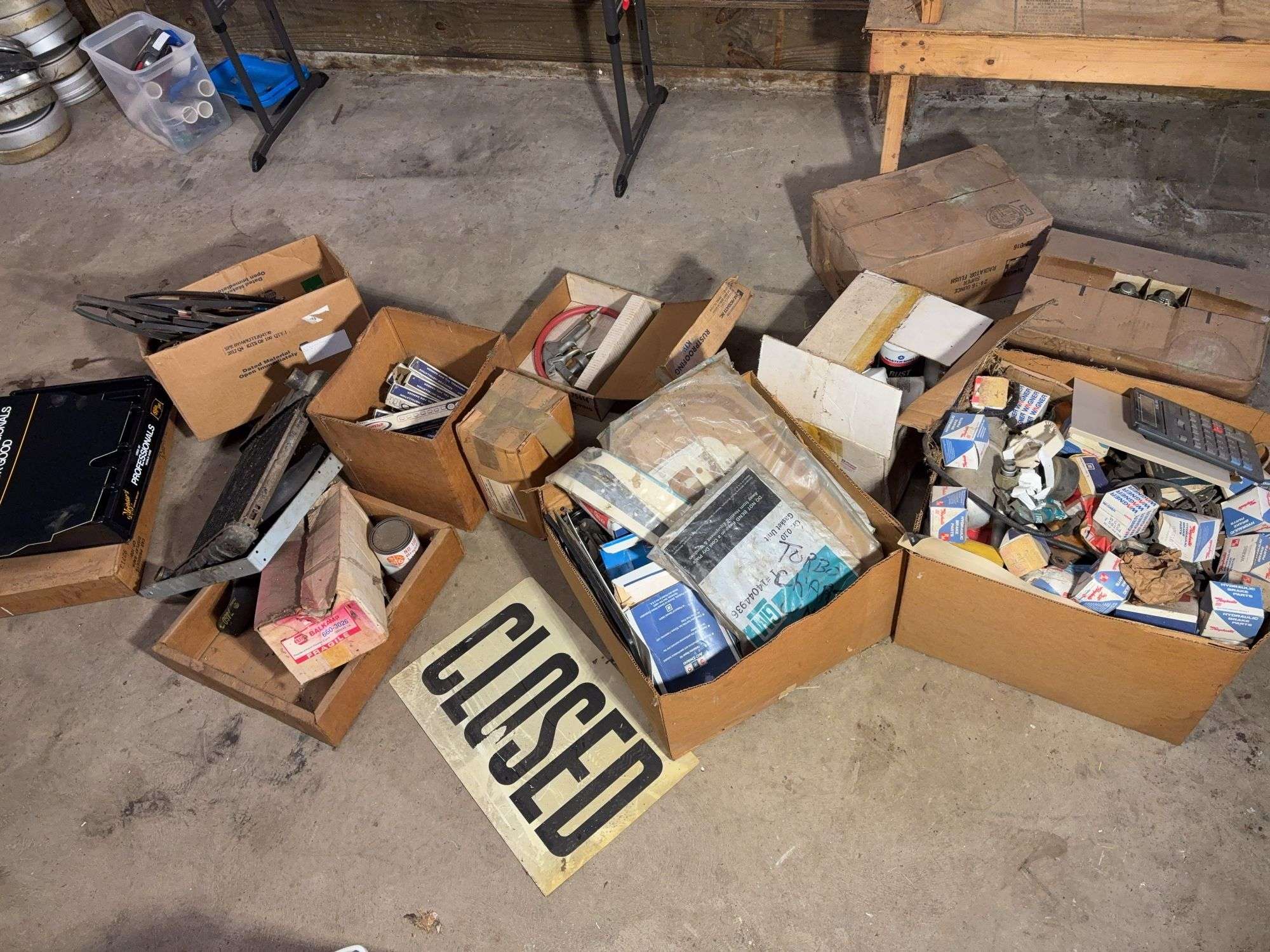 Large assortment of car parts, office supplies, and miscellaneous