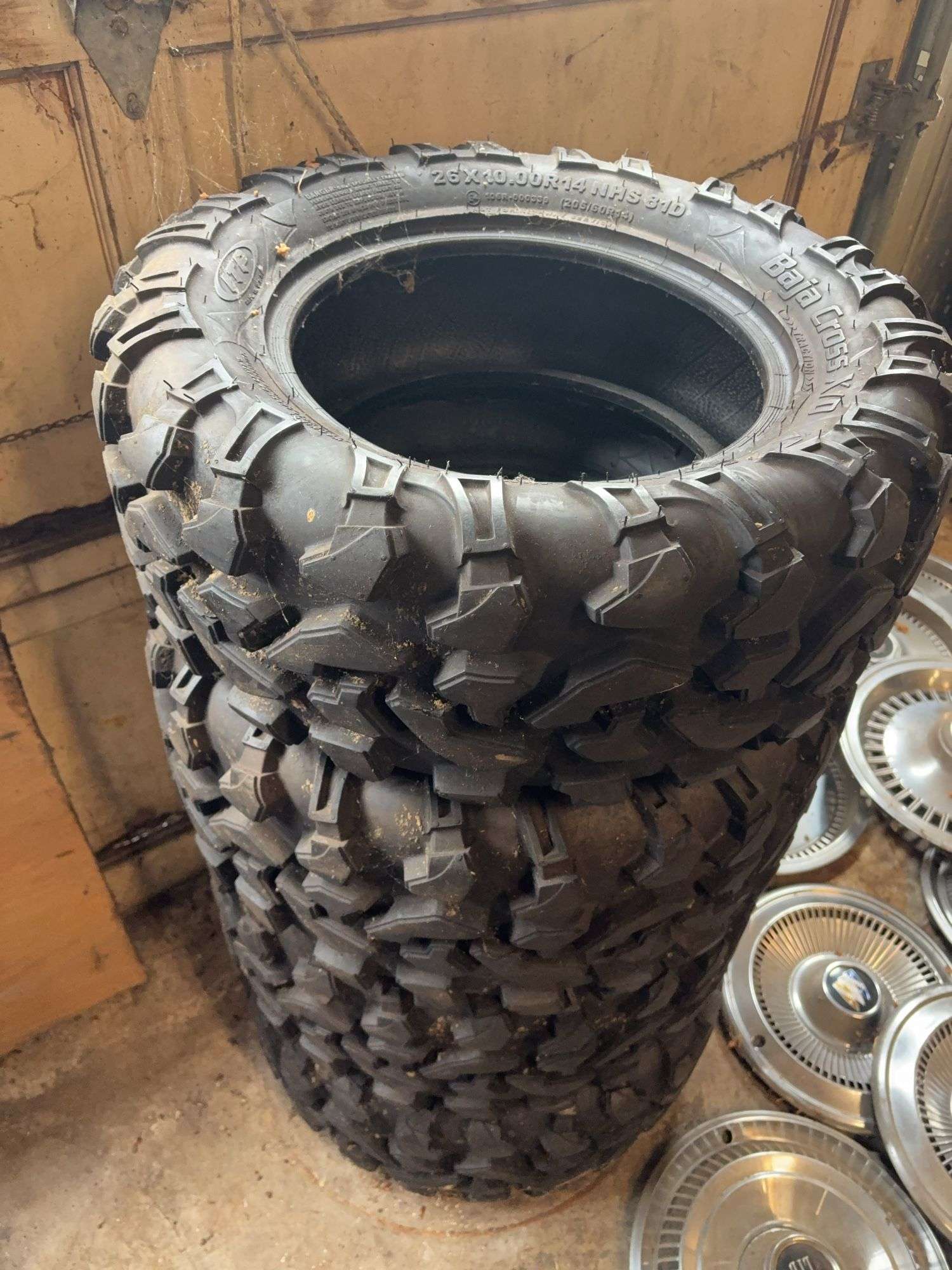 (4) tires like new - 26/10.00/14 - see photos