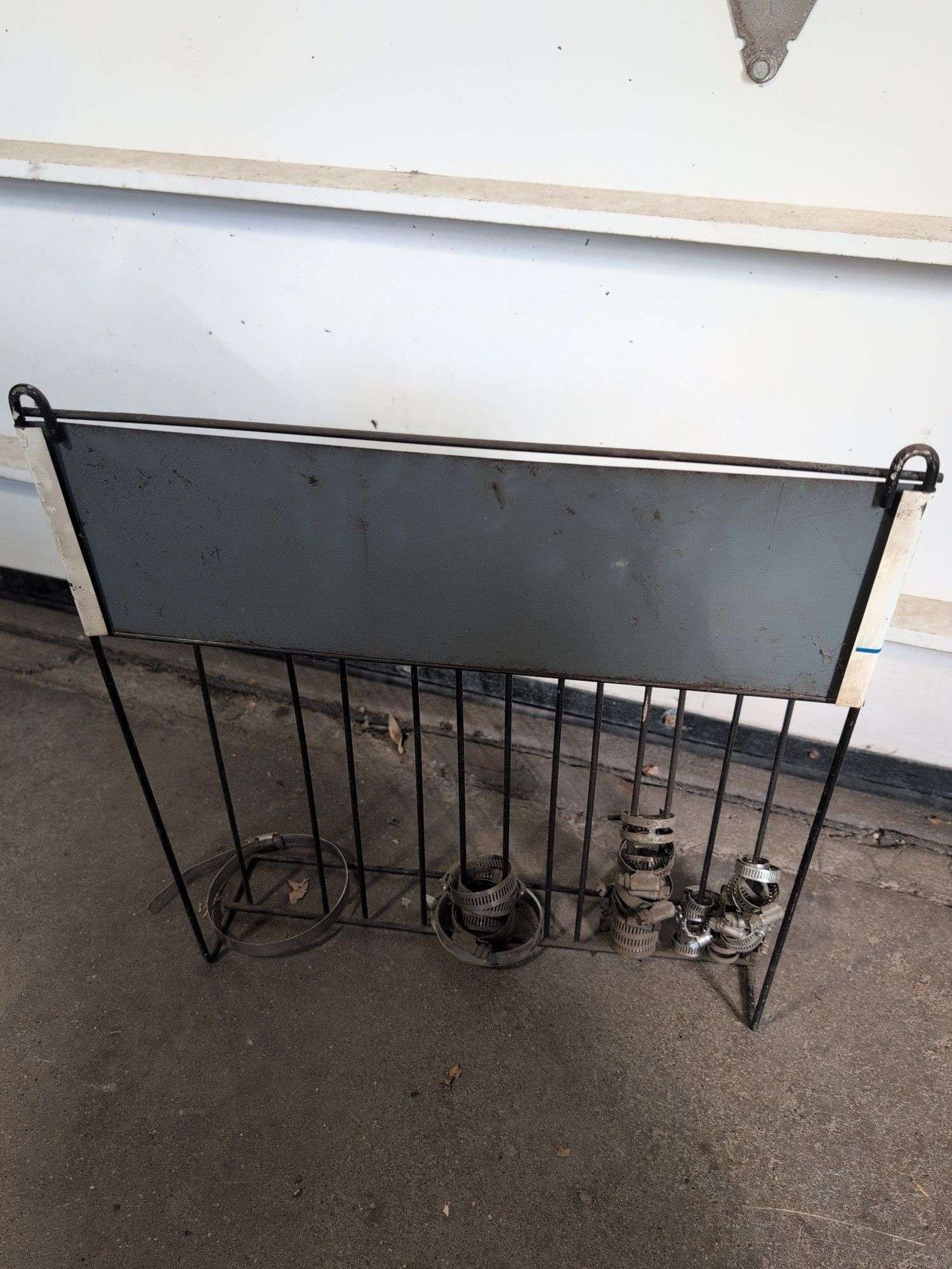 NAPA metal rack with hose clamps