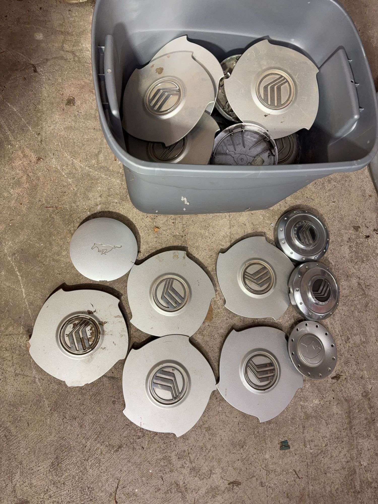 Tote of Miscellaneous hub caps and parts -see photos