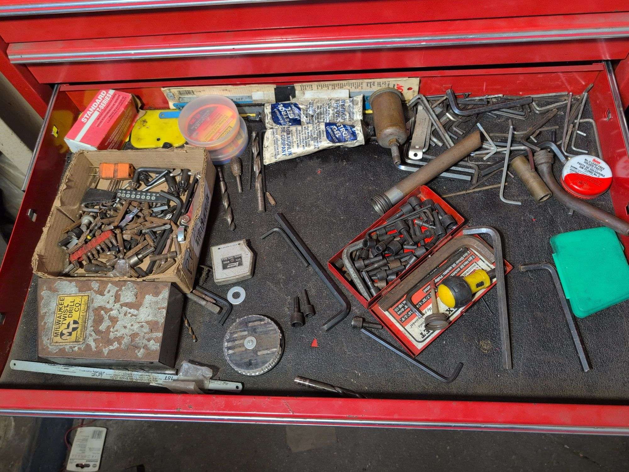 Drawer of drill bits, Allen wrenches, sockets, and more