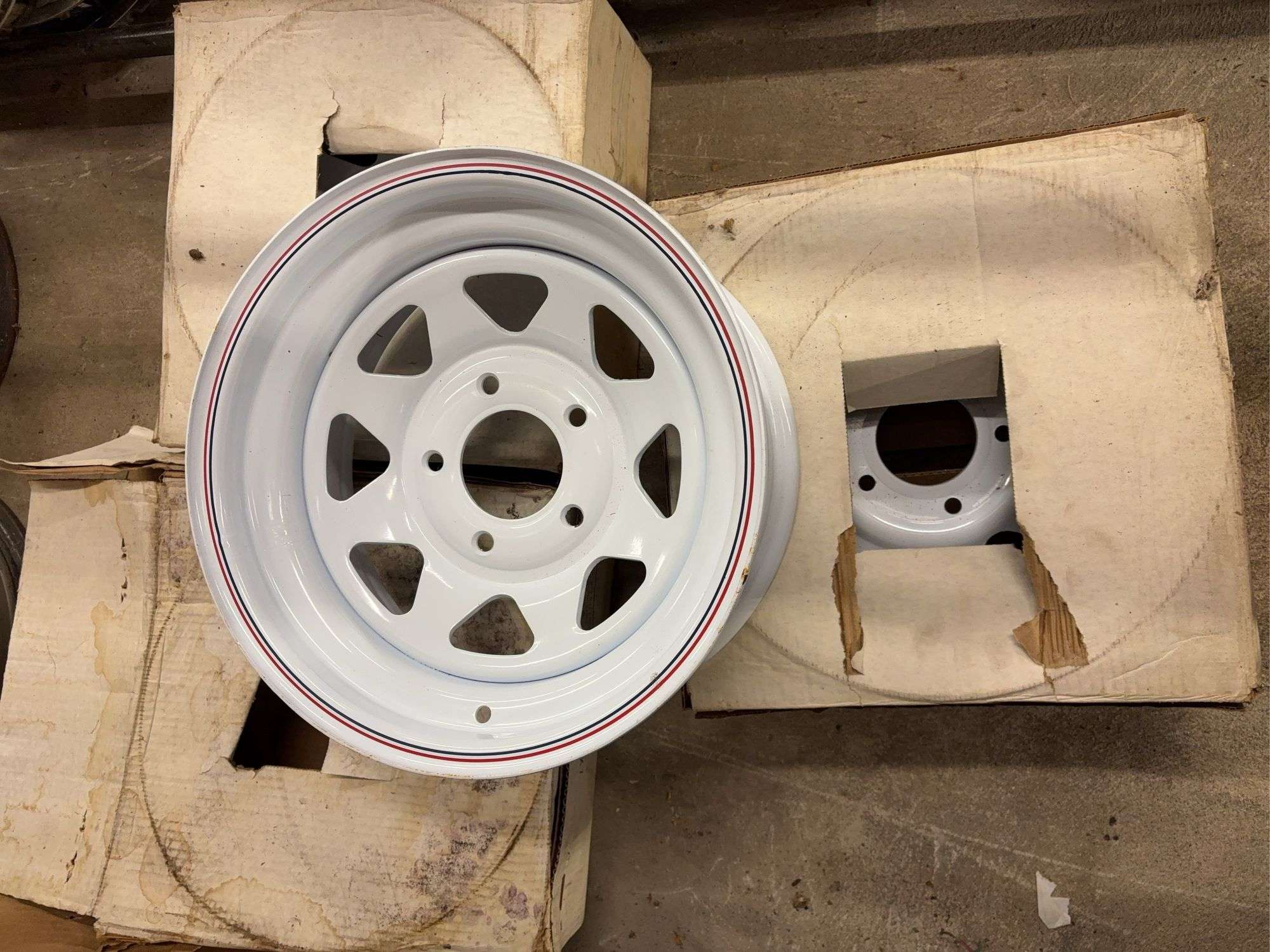 (4) 15” wheel rims in boxes