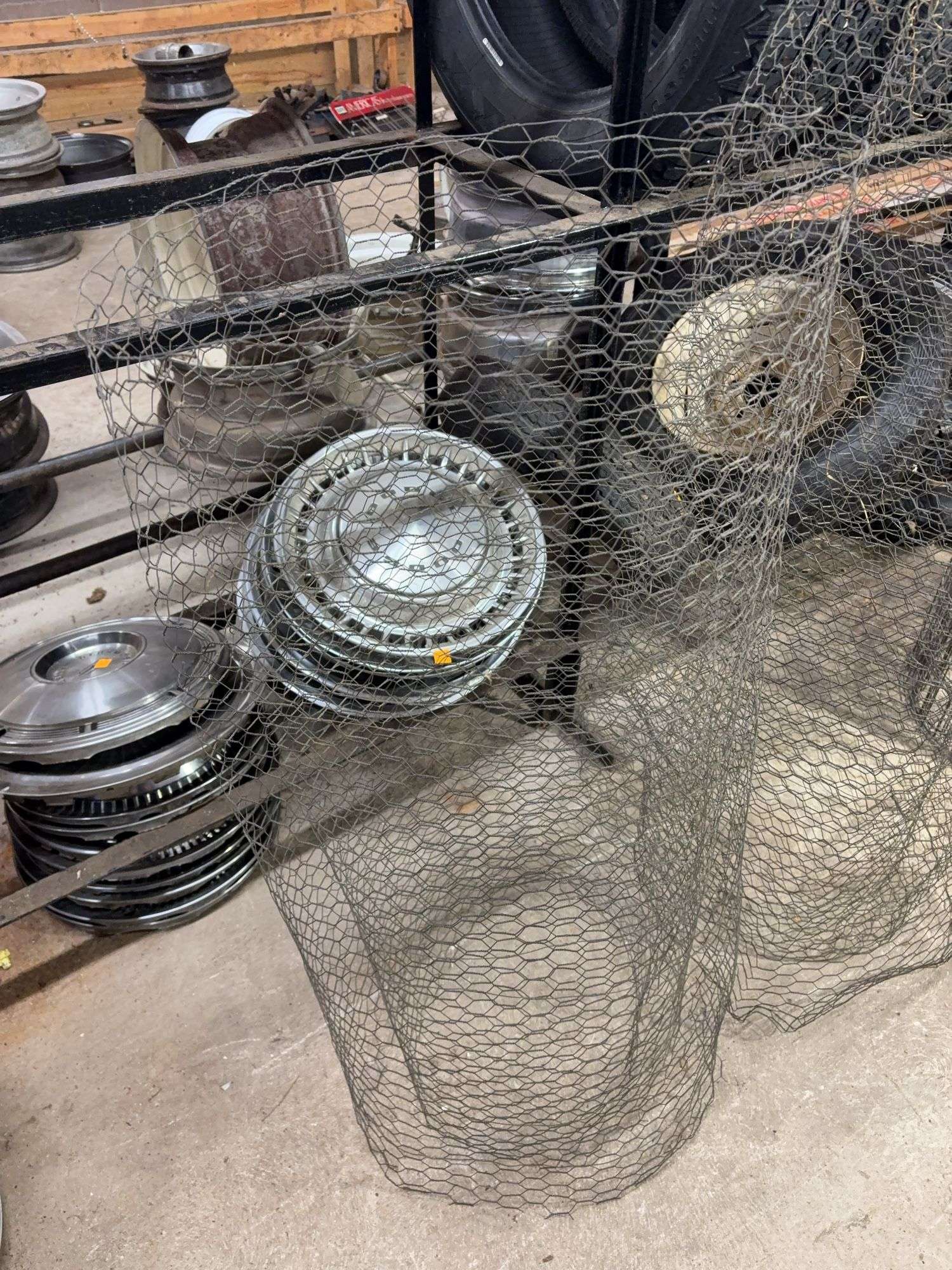 Chicken wire, metal fencing, and 6' wooden fencing