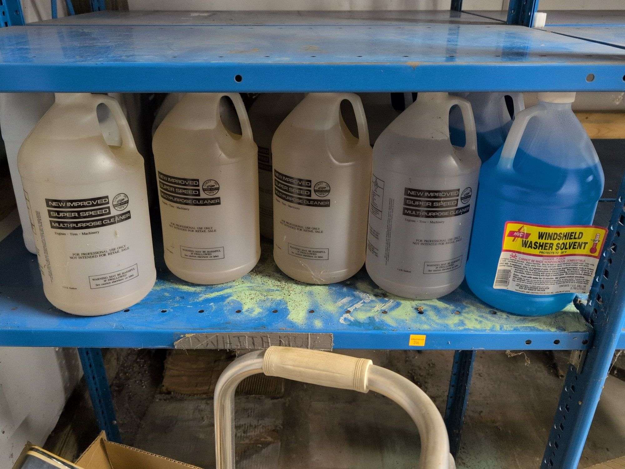 Shelf of coolant, cleaners, windshield washer solvent, and more