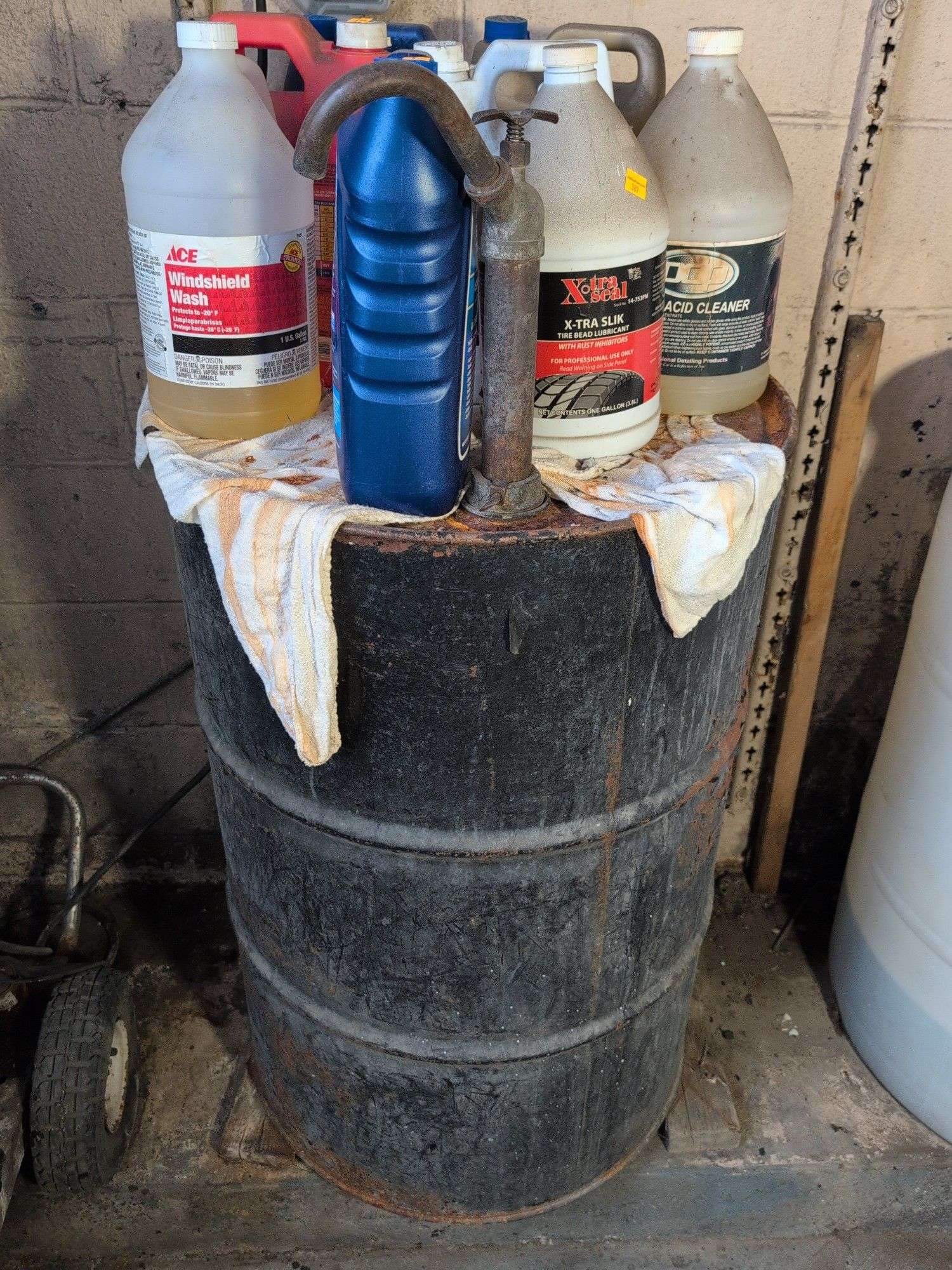 55 gallon metal drum with some antifreeze