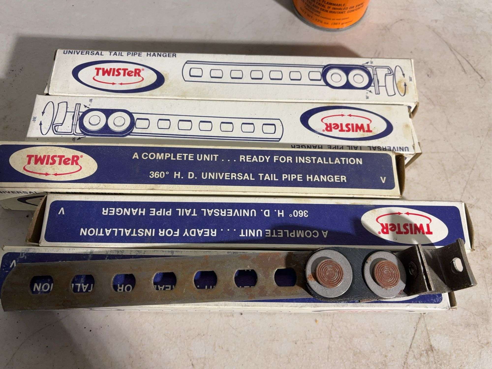 (5) Twister universal tail pipe hangers, lightbulbs, brushes and more