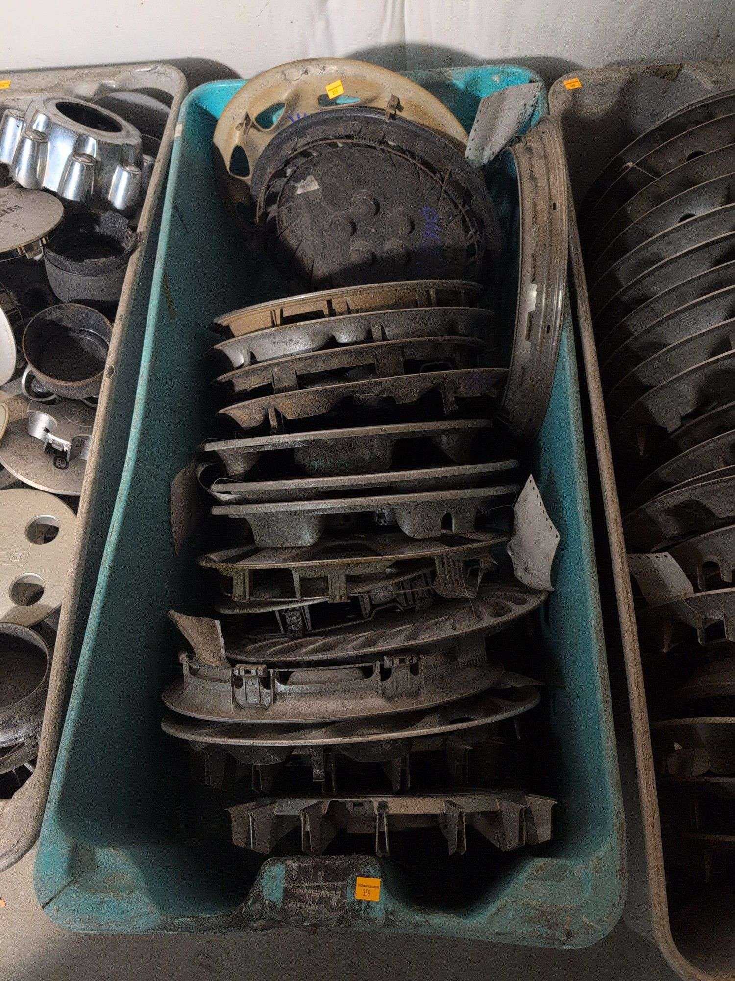 Tote of hubcaps - Mazda and others