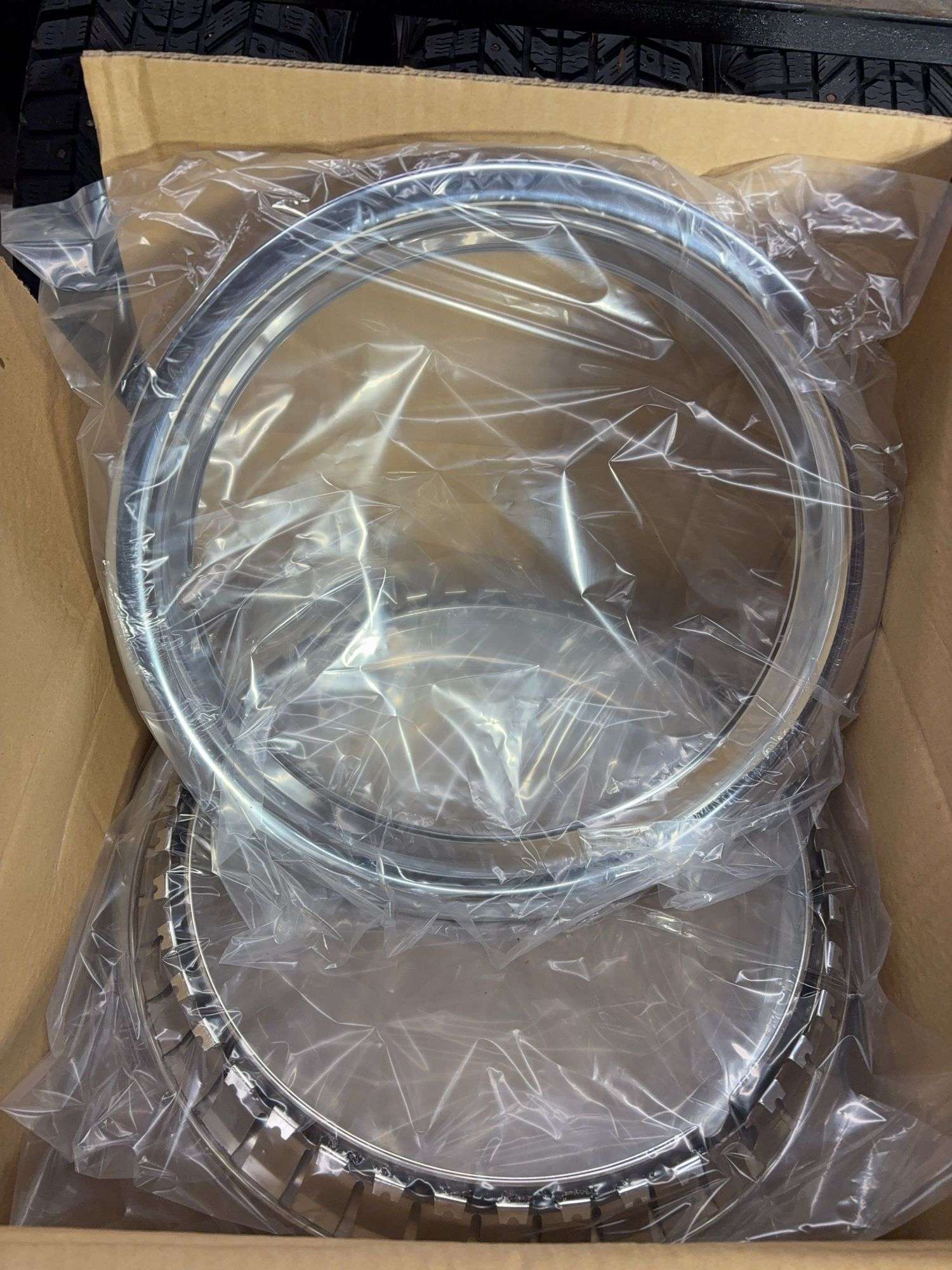 (2) wheel rims in boxes - see photos