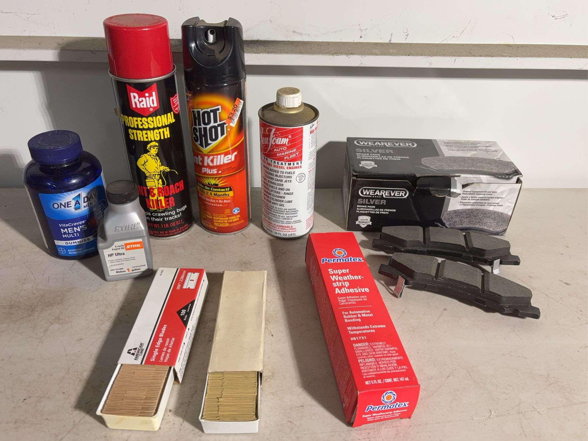 (2) Mostly full spray cans - Raid and ant killer, Silver brake pads, single edge blades and more -se