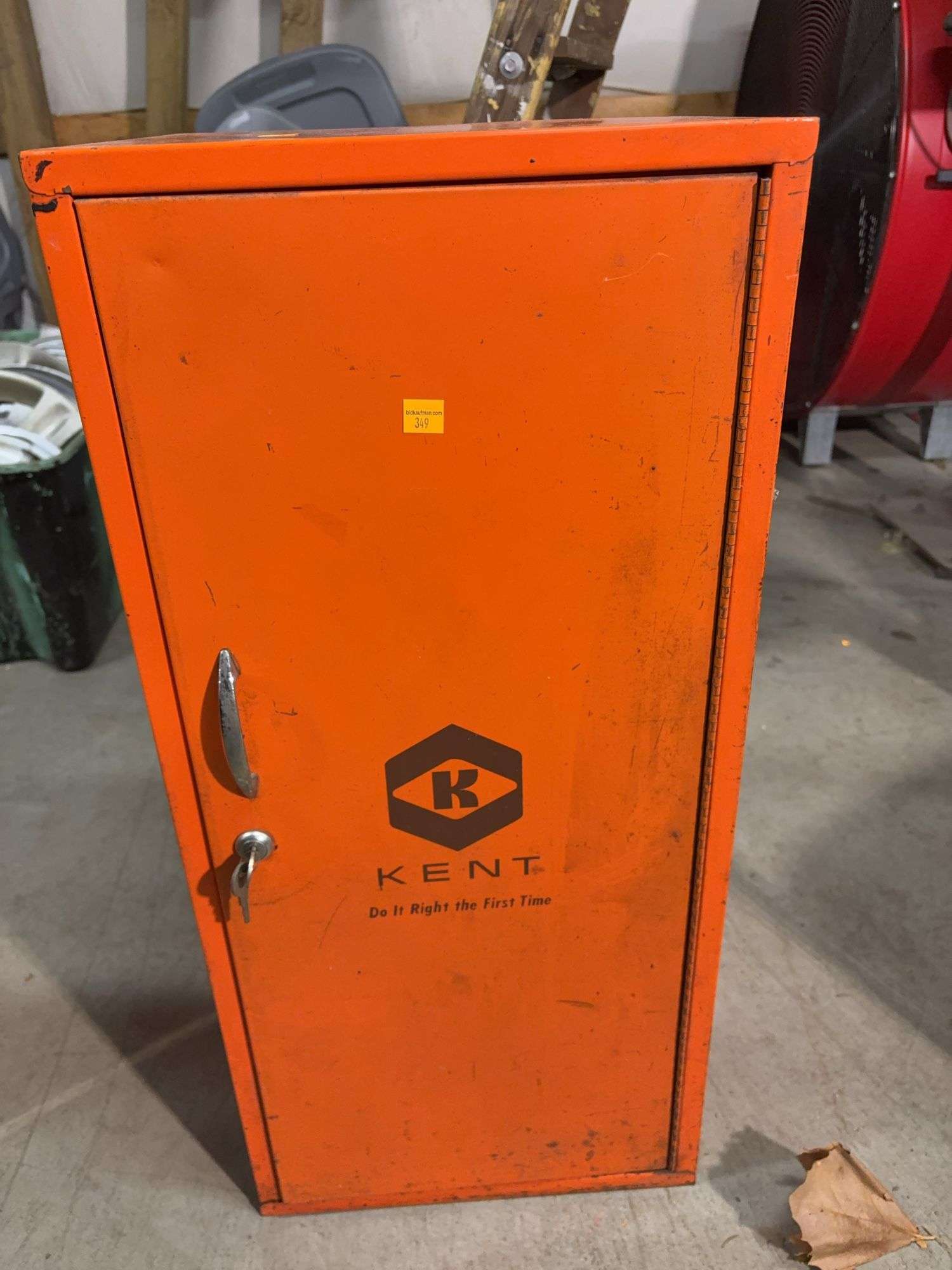 Orange metal storage cabinet marked Kent with keys - 14" x 13" x 30"