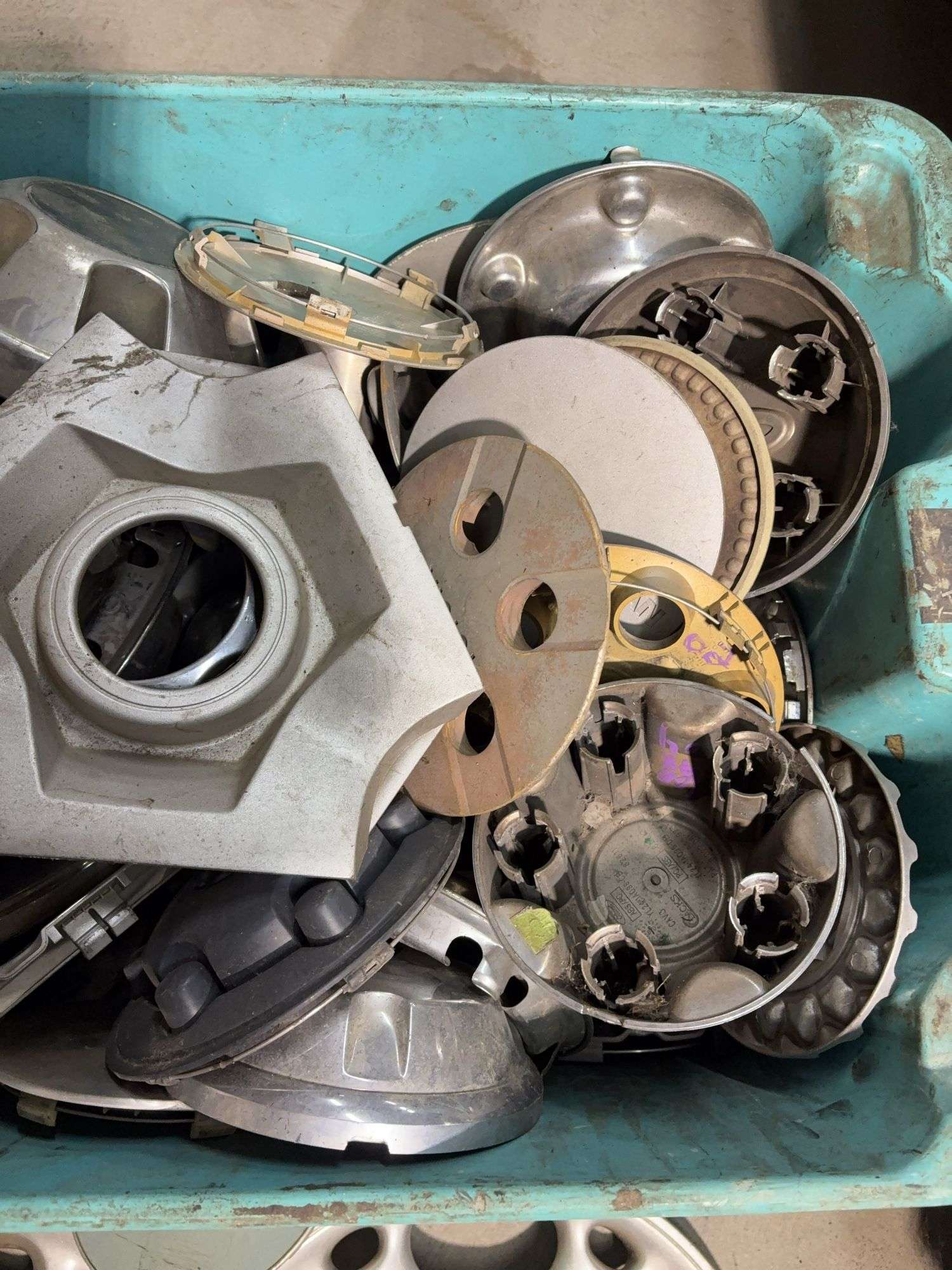 Large tote of hub caps and parts -Honda, Mazda, Nissan and more
