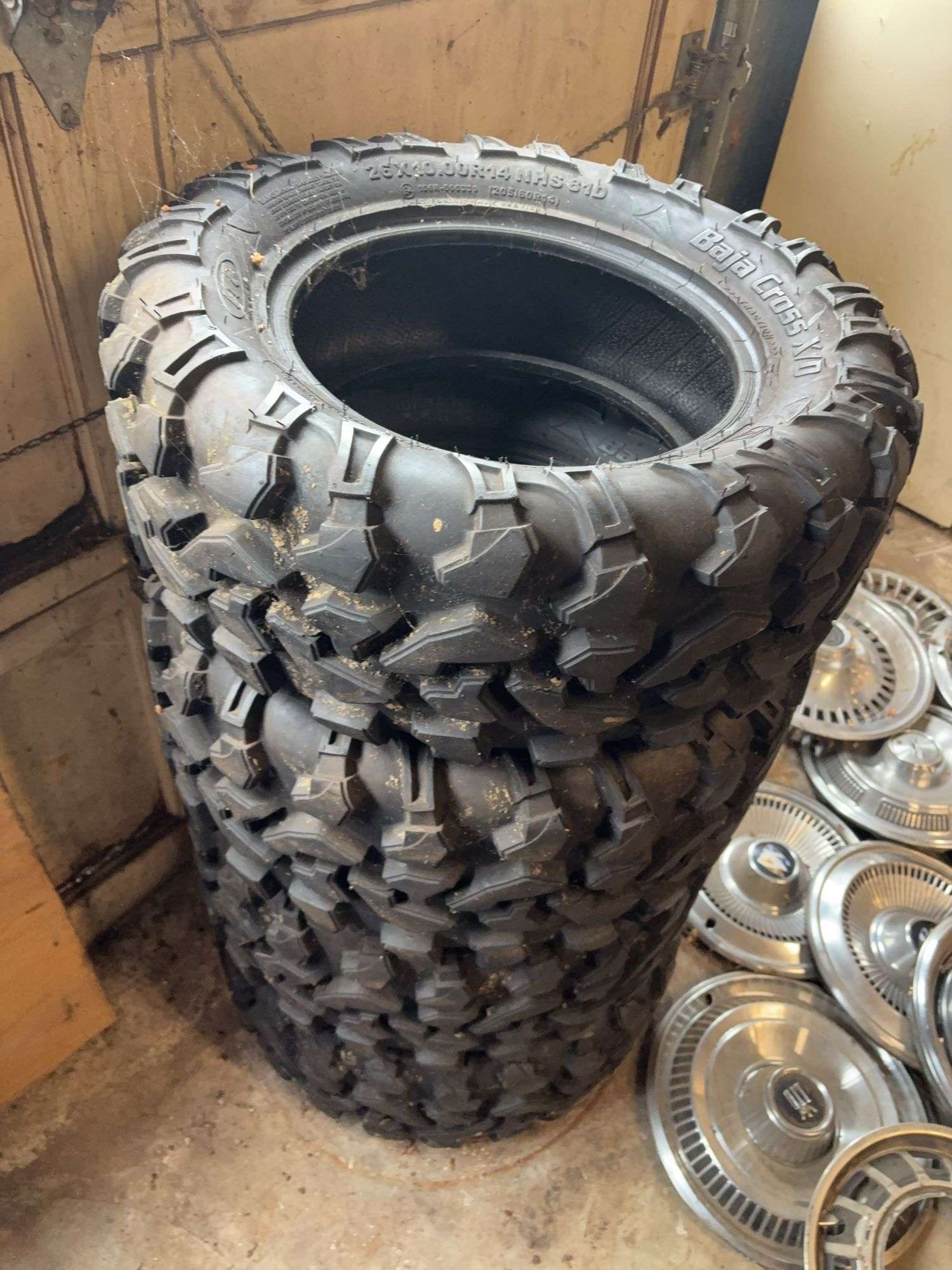 (4) tires like new - 26/10.00/14 - see photos