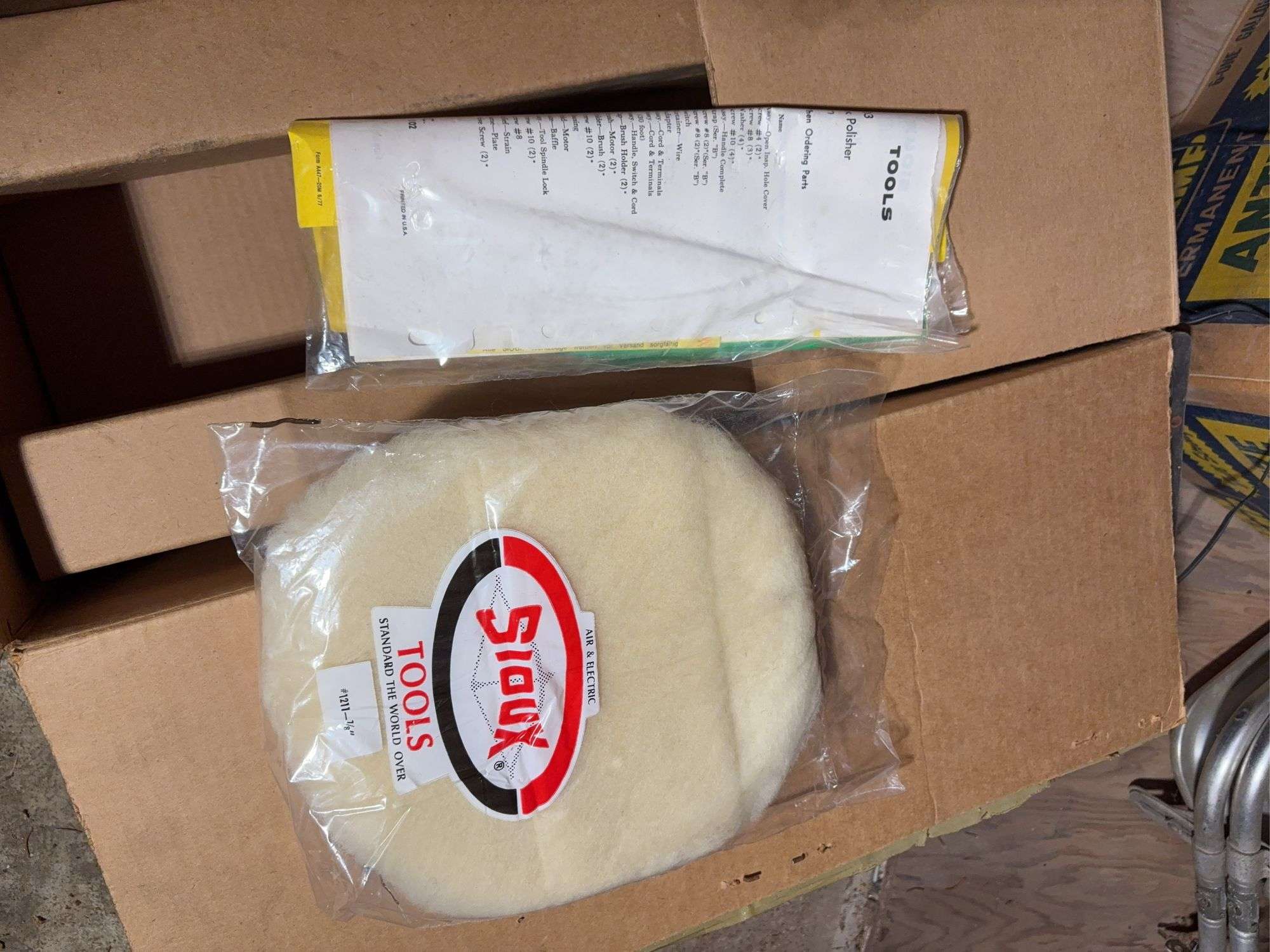 Contents of cabinet - oil filters, wiper blades, CB radios, manuals, and more