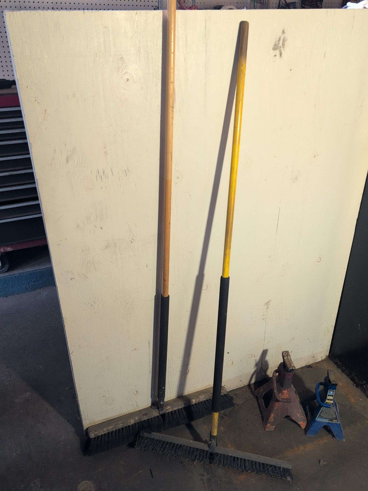 (2) shop brooms and (2) jack stands