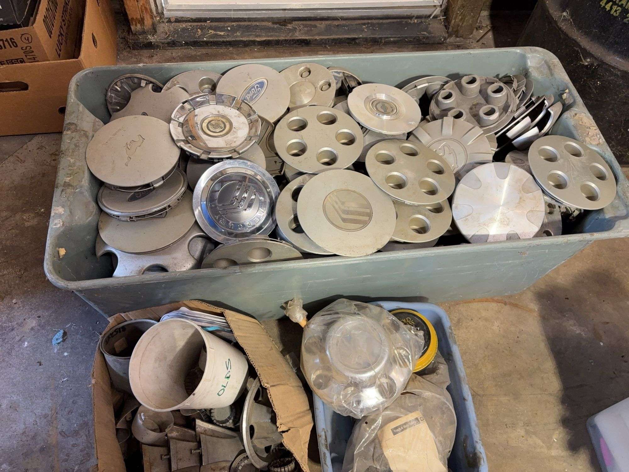 Large lot of miscellaneous hub caps and parts, paste wax and more