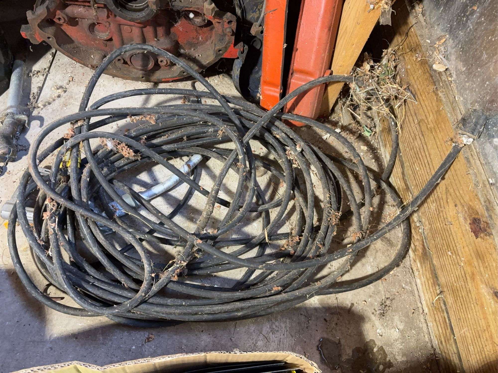 Bucket of hydraulic oil, extension cord, gas nozzles, and more