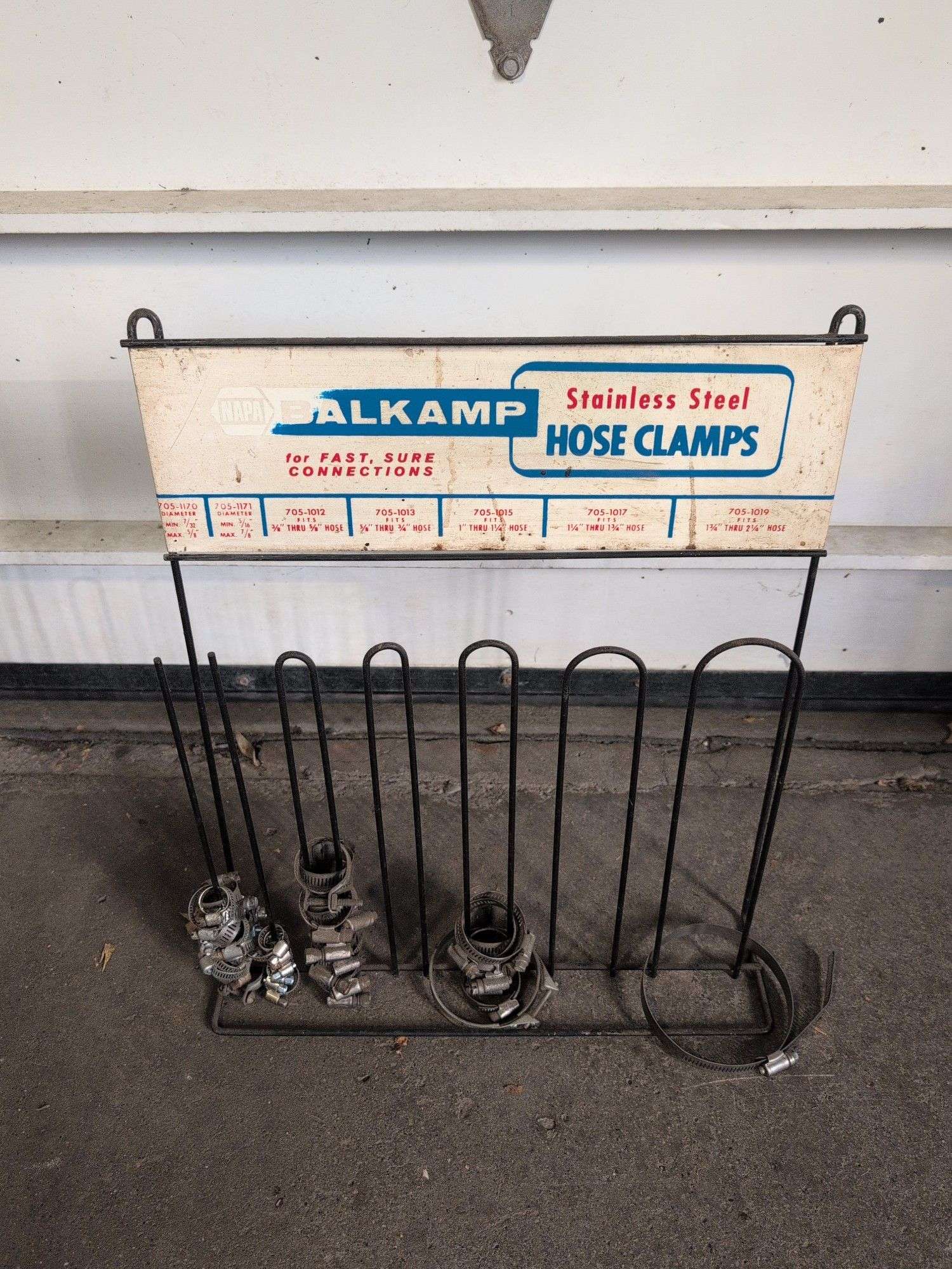 NAPA metal rack with hose clamps