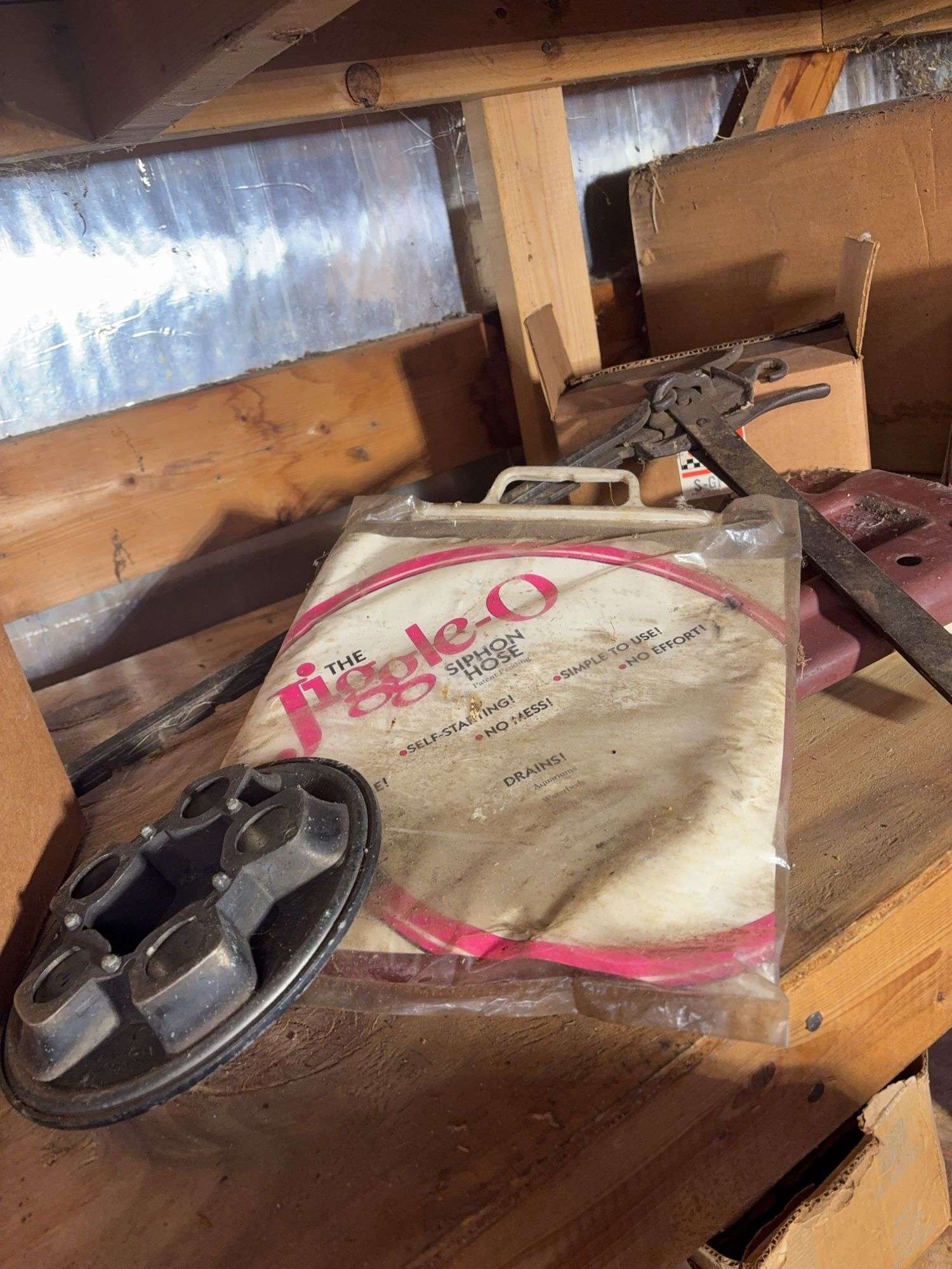 Shelf of miscellaneous car parts and other items