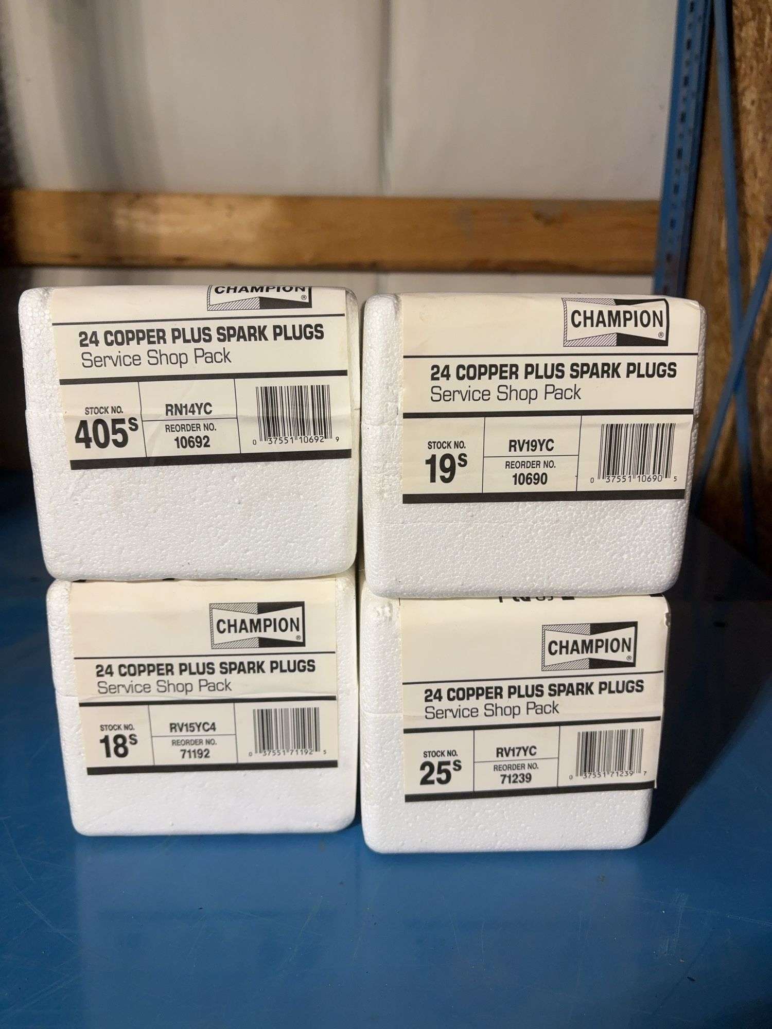 (4) Champion boxes of 24 copper plus spark plugs