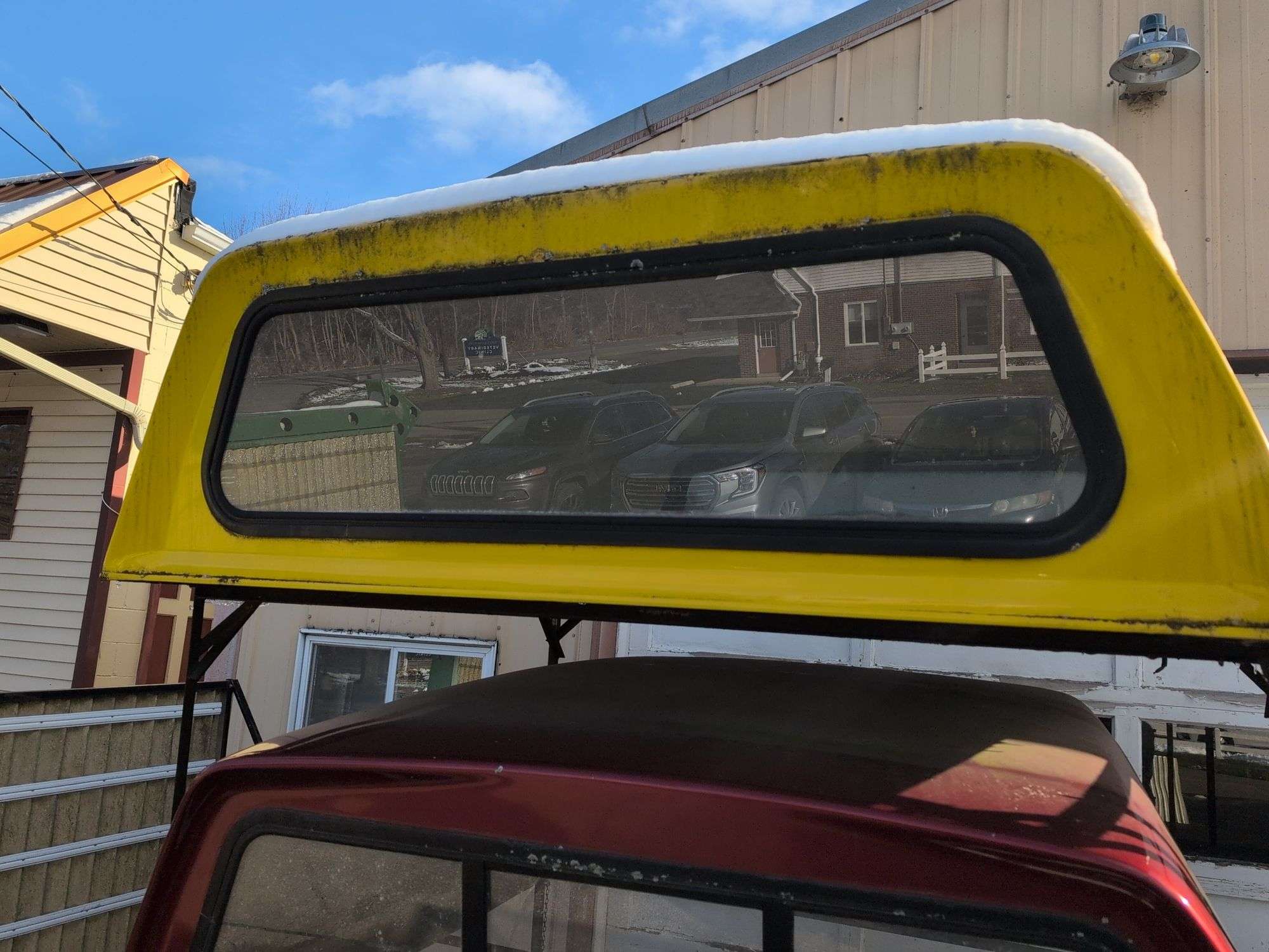 Yellow truckbed cap for a Dodge - 6' wide, 79" long