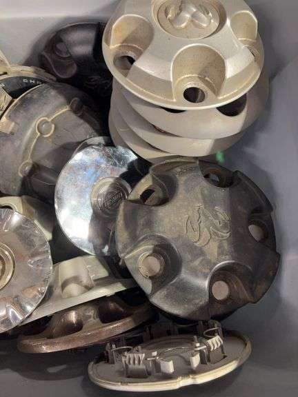 Large tote of hub caps and parts - Mostly Ram -see photos