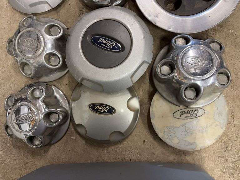Tote of Ford hub caps and parts