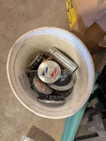 Assortment of hub caps including Jeep, Buick, and Chevy -see photos