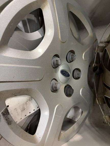 Large tote of hub caps and parts -Pontiac, Chrysler and more