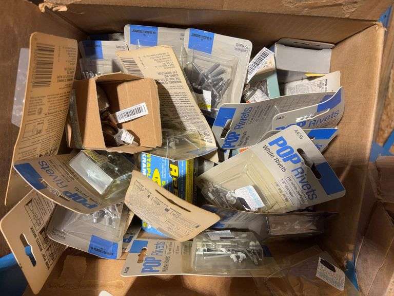 Box of pop rivets mostly unopened, Arrow staples, New Holland parts and more
