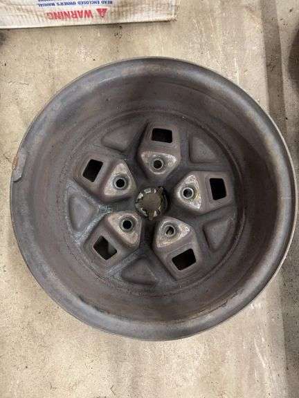 (2) 14” Pontiac wheel rims in boxes