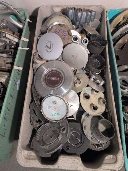 Tote of hubcaps/center caps - Acura, Nissan, Ram, and many more