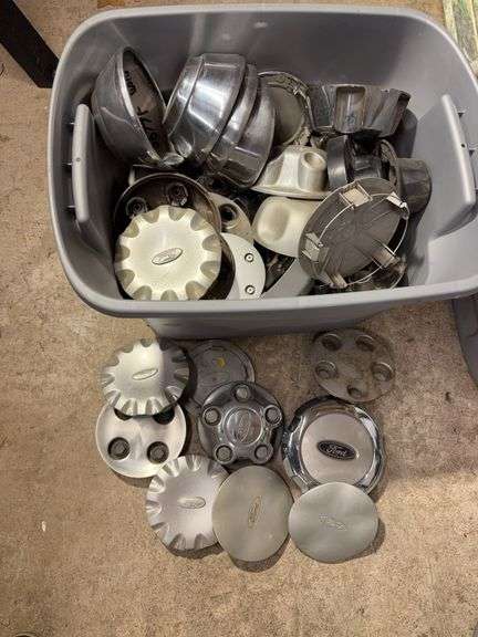 Tote of Ford hub caps and parts