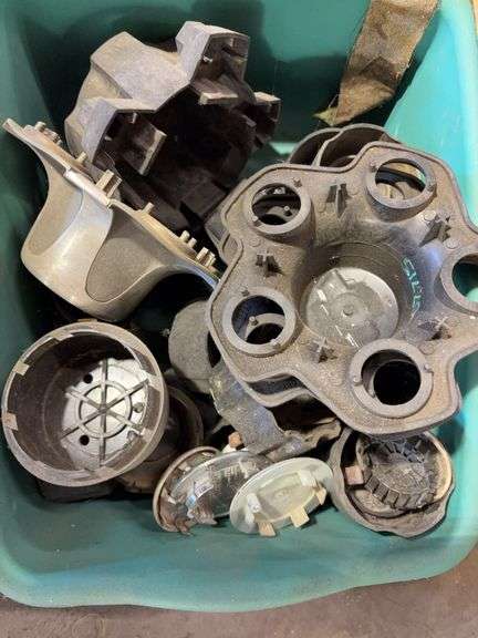 Assortment of hub caps including Jeep, Buick, and Chevy -see photos