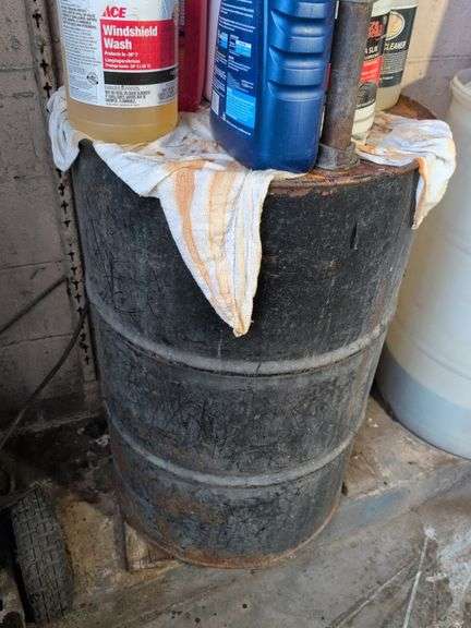 55 gallon metal drum with some antifreeze