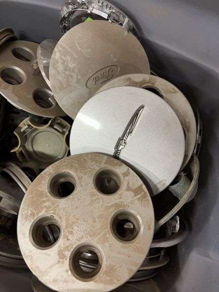 Tote of Miscellaneous hub caps and parts -see photos