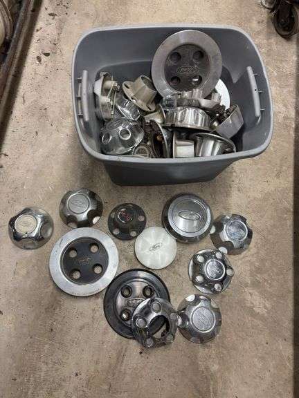 Tote of Ford hub caps and parts