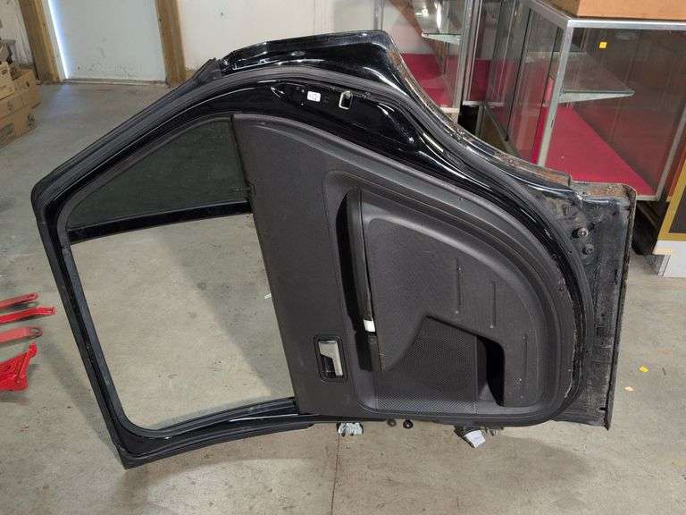 Unmarked black vehicle door - see photos