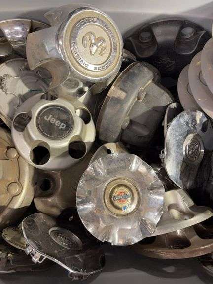 Large tote of hub caps and parts - Mostly Ram -see photos