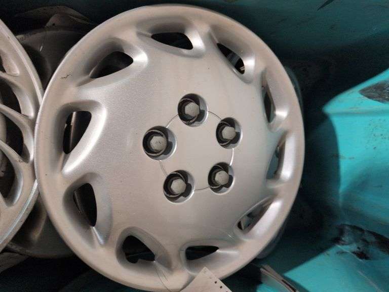 Tote of hubcaps - Mazda and others