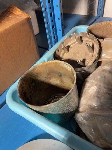 Tote of hub caps and parts, Jeep, Nissan, Toyota and more