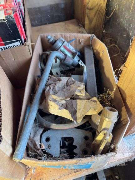 (2) shelves of vehicle-related items - sparkplugs, signs, and more