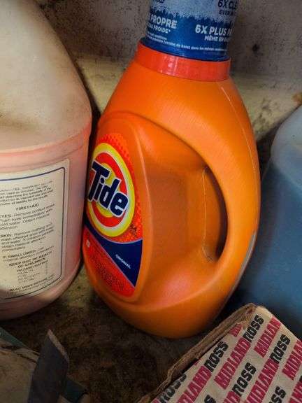 Shelf of shop rags and vehicle fluids