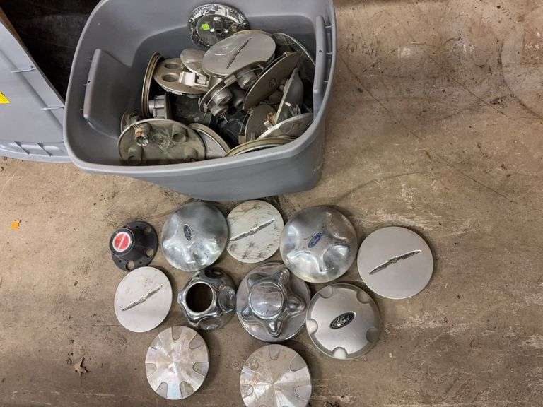 Tote of Miscellaneous hub caps and parts -see photos
