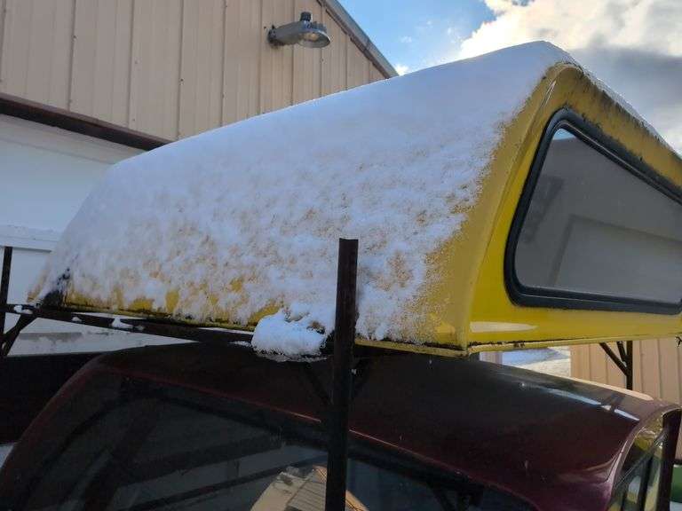 Yellow truckbed cap for a Dodge - 6' wide, 79" long