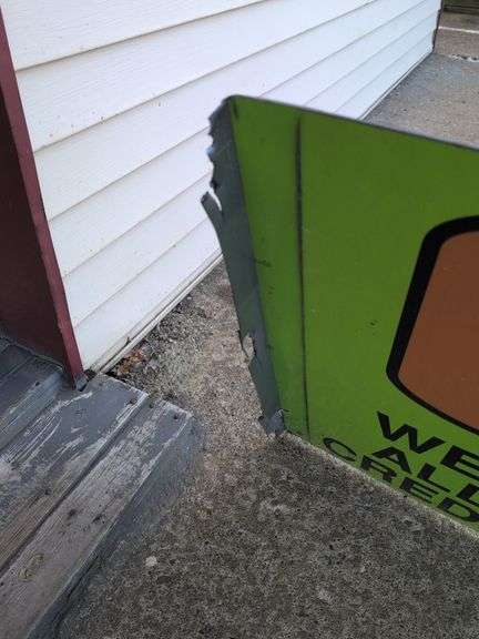 Large double-sided green metal sign - "Over 1000 tires in stock" - 8' x 28"