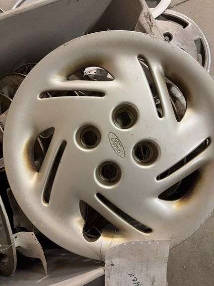 Large tote of hub caps and parts -Pontiac, Chrysler and more