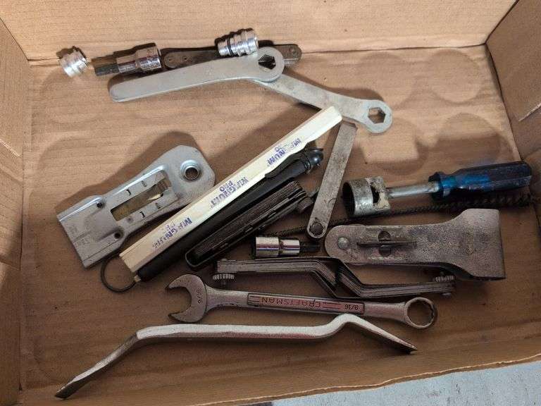 Flat of tools - staples, wrench, and more
