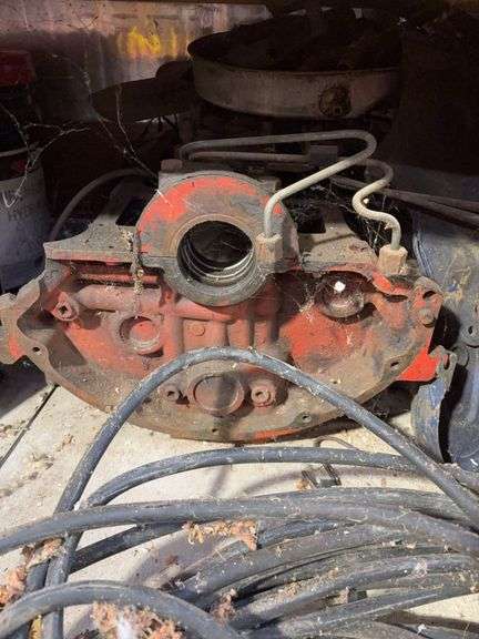 Bucket of hydraulic oil, extension cord, gas nozzles, and more